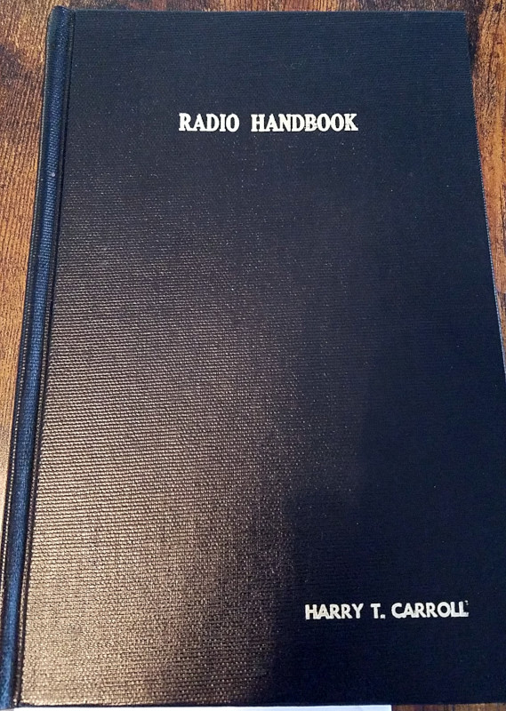 Hardbound copy of the 1926 First Edition ARRL Radio Amateur's Handbook.  The name of the original owner, Harry T. Carroll is embossed on the lower right corner of the front cover.