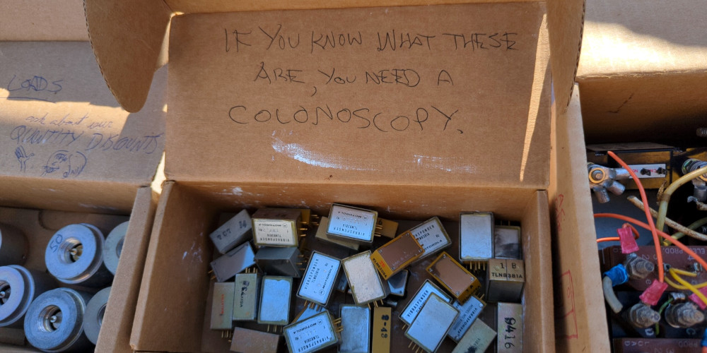 A box of Motorola Vibrasponder components. Written on the box is "If you know what these are, you need a colonoscopy"