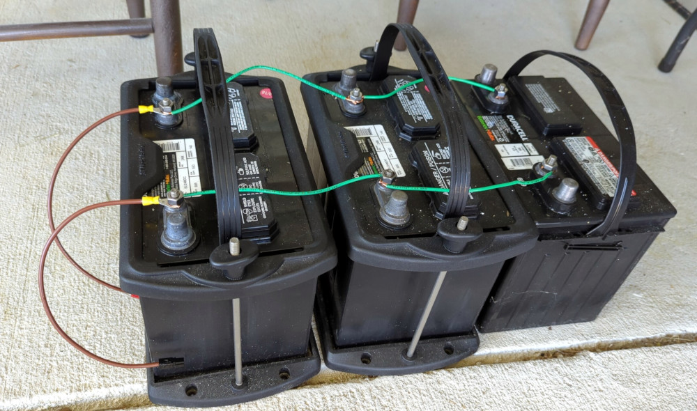 Three deep cycle AGM batteries connected together in parallel