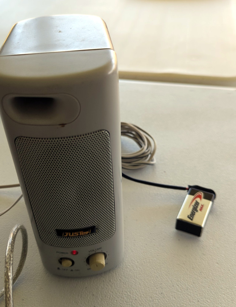 Computer speaker connected to a 9V battery for power